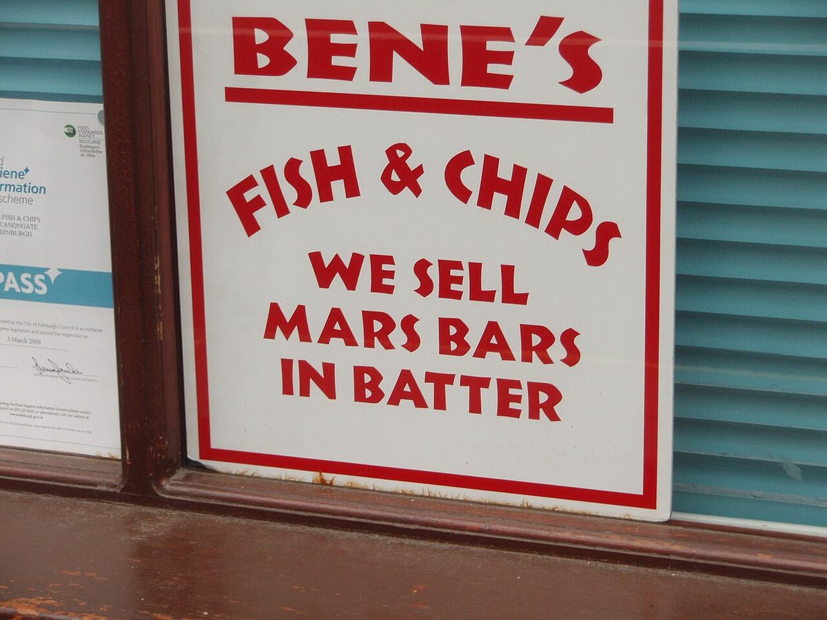 An Edinburgh chip shop sign advertising Mars bars in batter