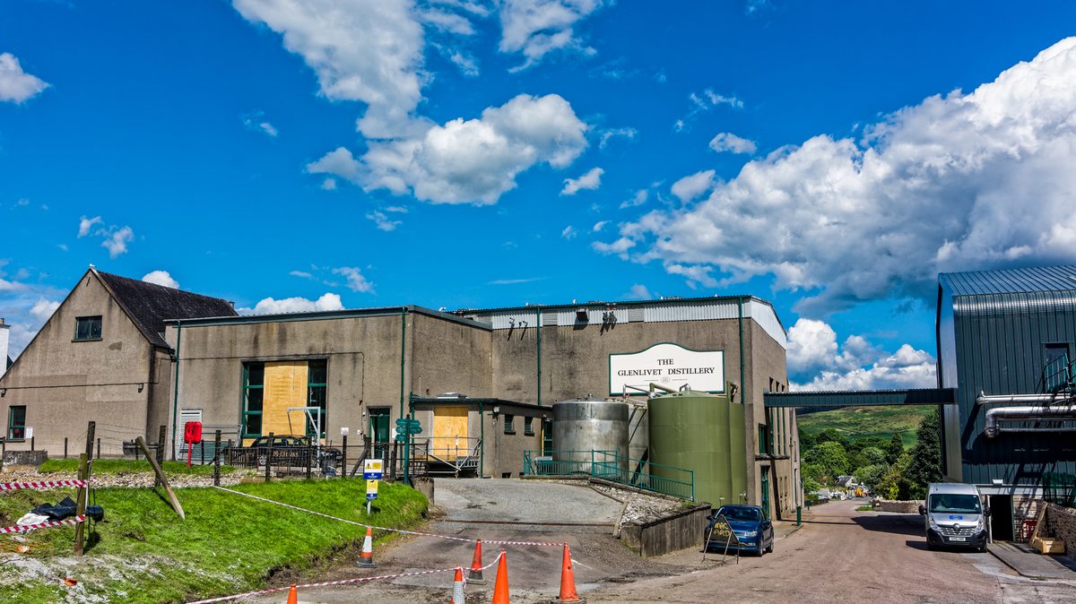 The Glenlivet distillery surrounded by Speyside hills