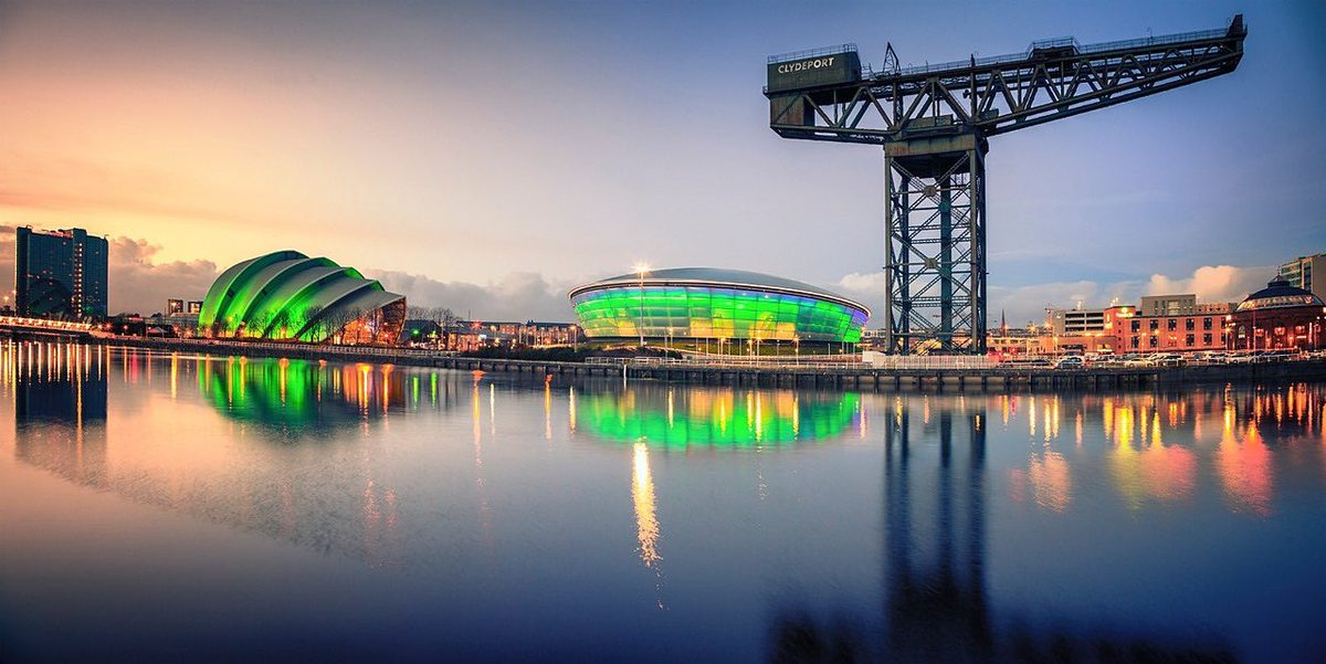 OVO Hydro arena illuminated at night on the River Clyde, Glasgow