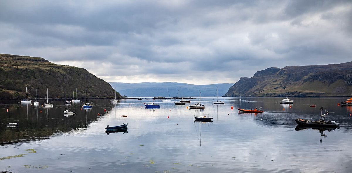 The painted harbour houses of Portree, the most popular place to stay on the Isle of Skye