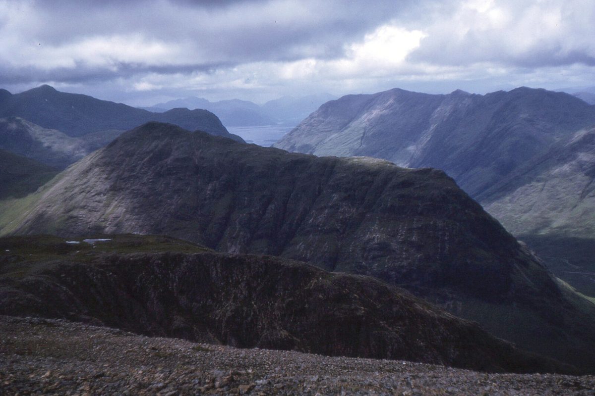 Moody weather over the mountains of Glen Coe - pack layers for four seasons in one day
