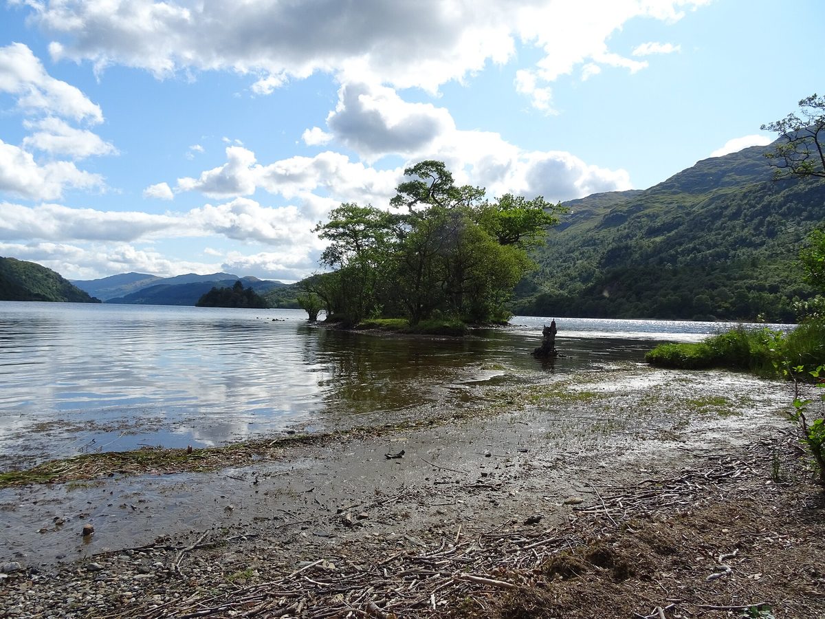 A quiet shore of Loch Lomond - wild camping here needs a permit in summer, but it's free almost everywhere else in Scotland