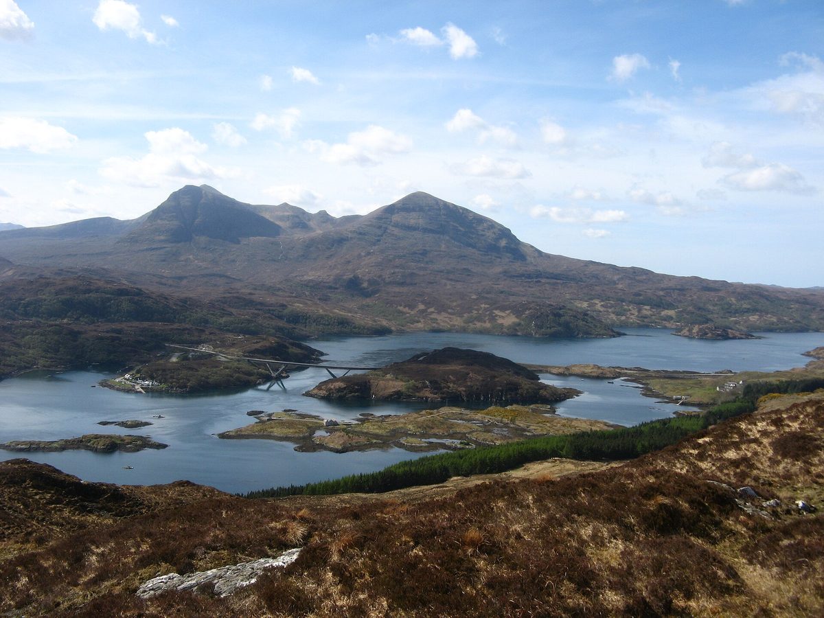 The curving Kylesku Bridge spanning Loch a Chairn Bhain on the North Coast 500