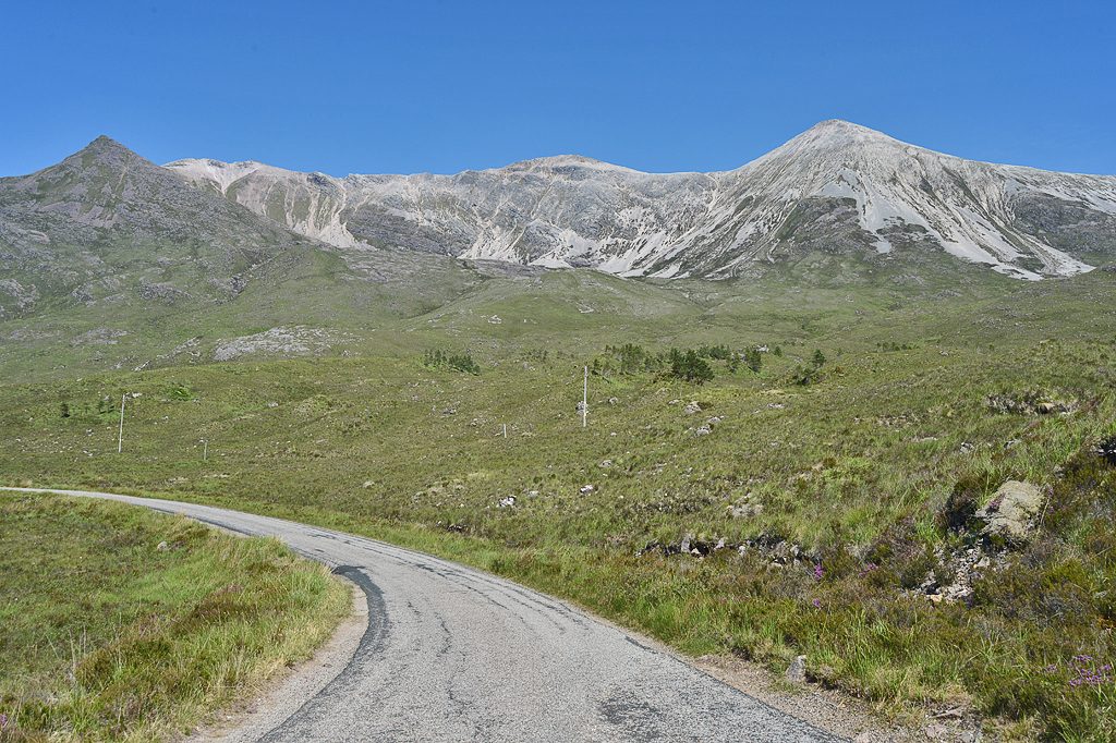 The single track Torridon road below the quartzite slopes of Beinn Eighe in Wester Ross