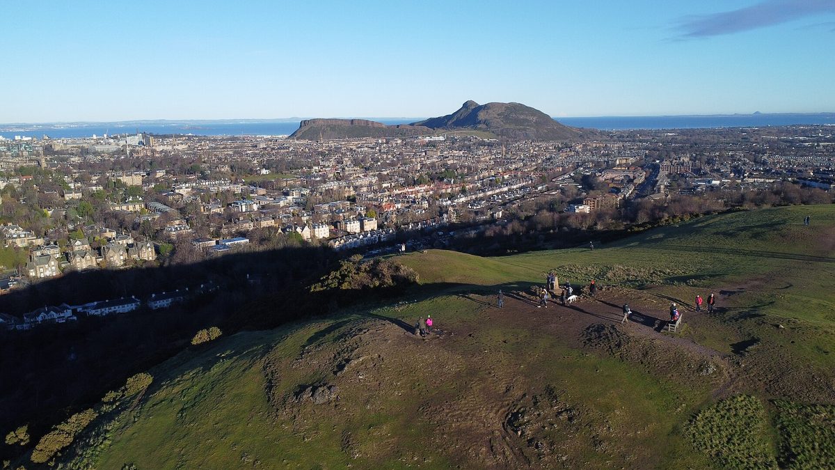 Arthur’s Seat and the Salisbury Crags rising over the rooftops of Edinburgh