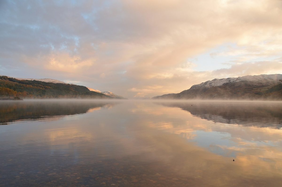 Loch Ness at dawn, mist lying on the water between the hills of the Great Glen