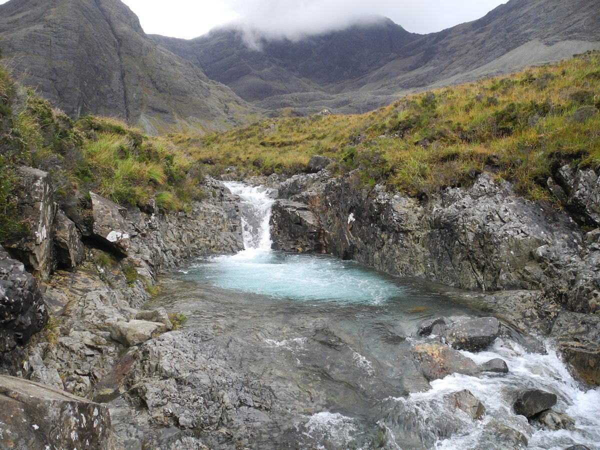 A plunge pool and waterfall at the Fairy Pools in Glen Brittle, below the Black Cuillin on Skye
