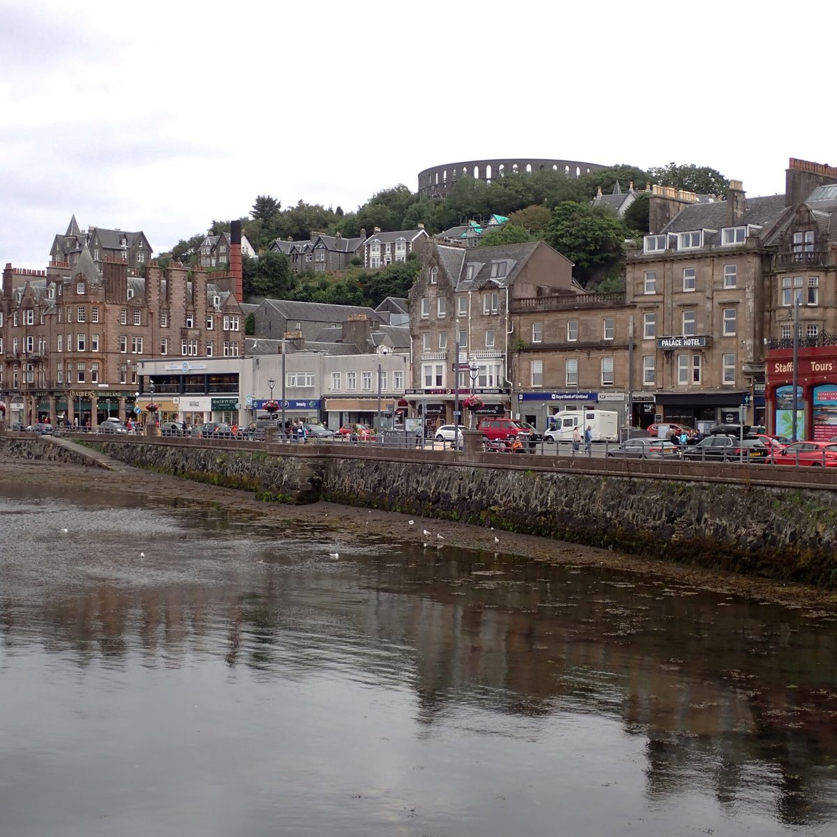 The seafront at Oban with McCaig’s Tower on the hill above, the ferry gateway to Mull