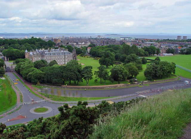 Looking down from Salisbury Crags over the Palace of Holyroodhouse and Queen's Drive, the main start point for the Arthur's Seat hike
