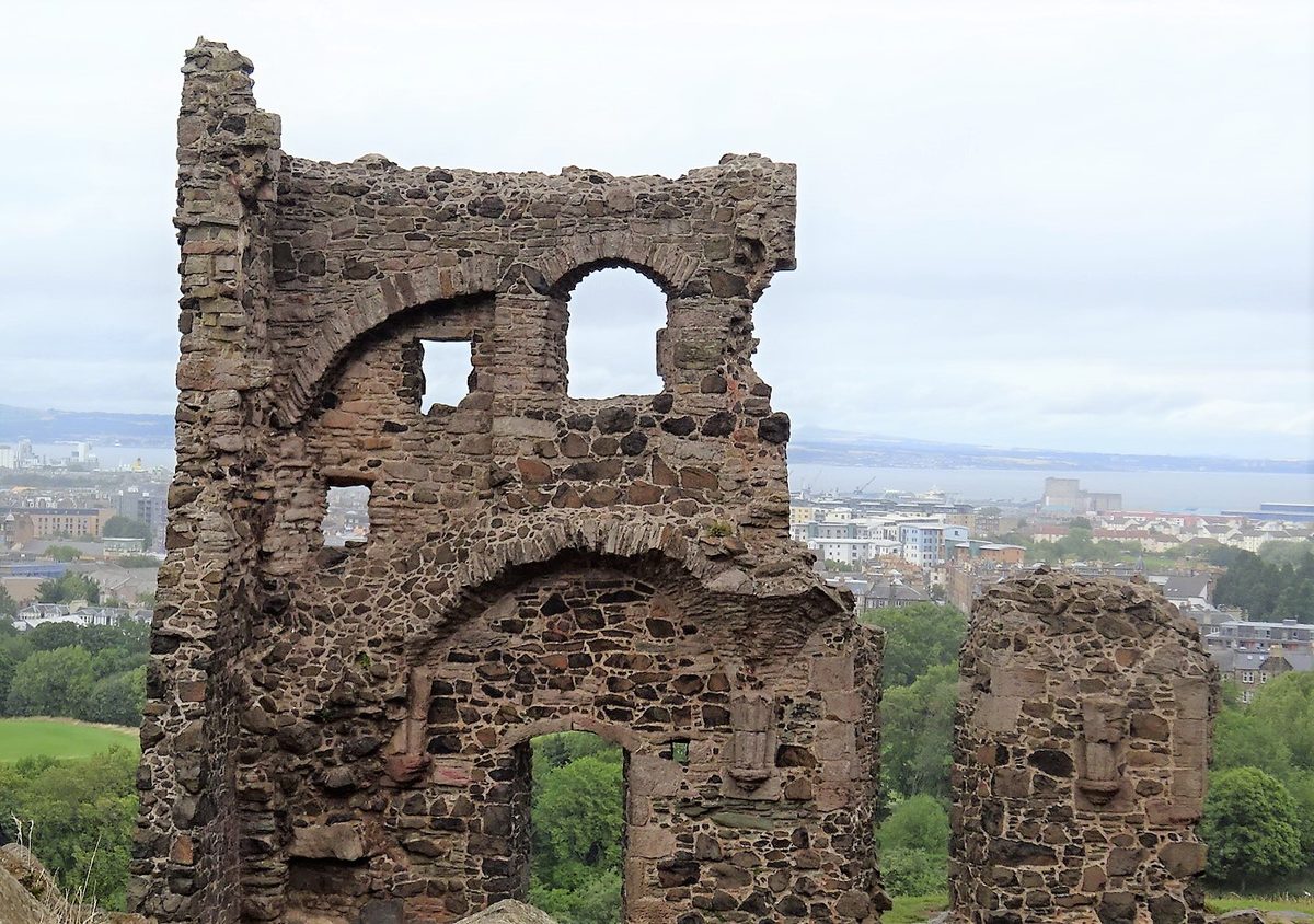 The ruins of St Anthony's Chapel above St Margaret's Loch, looking out over Leith and the Firth of Forth