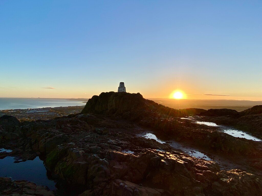 Sunrise from the trig point on the summit of Arthur's Seat, looking east over the Firth of Forth
