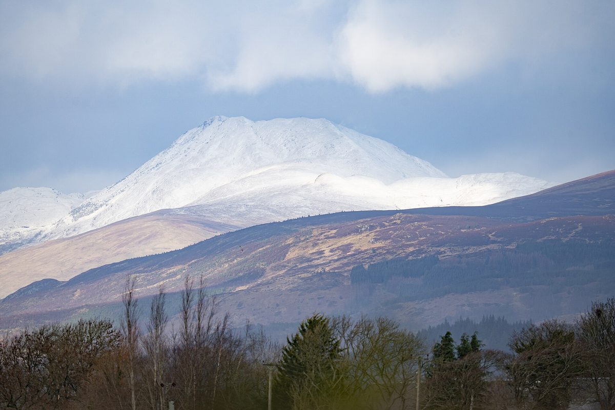 Snow on Ben Lomond above the Loch Lomond shore in late winter
