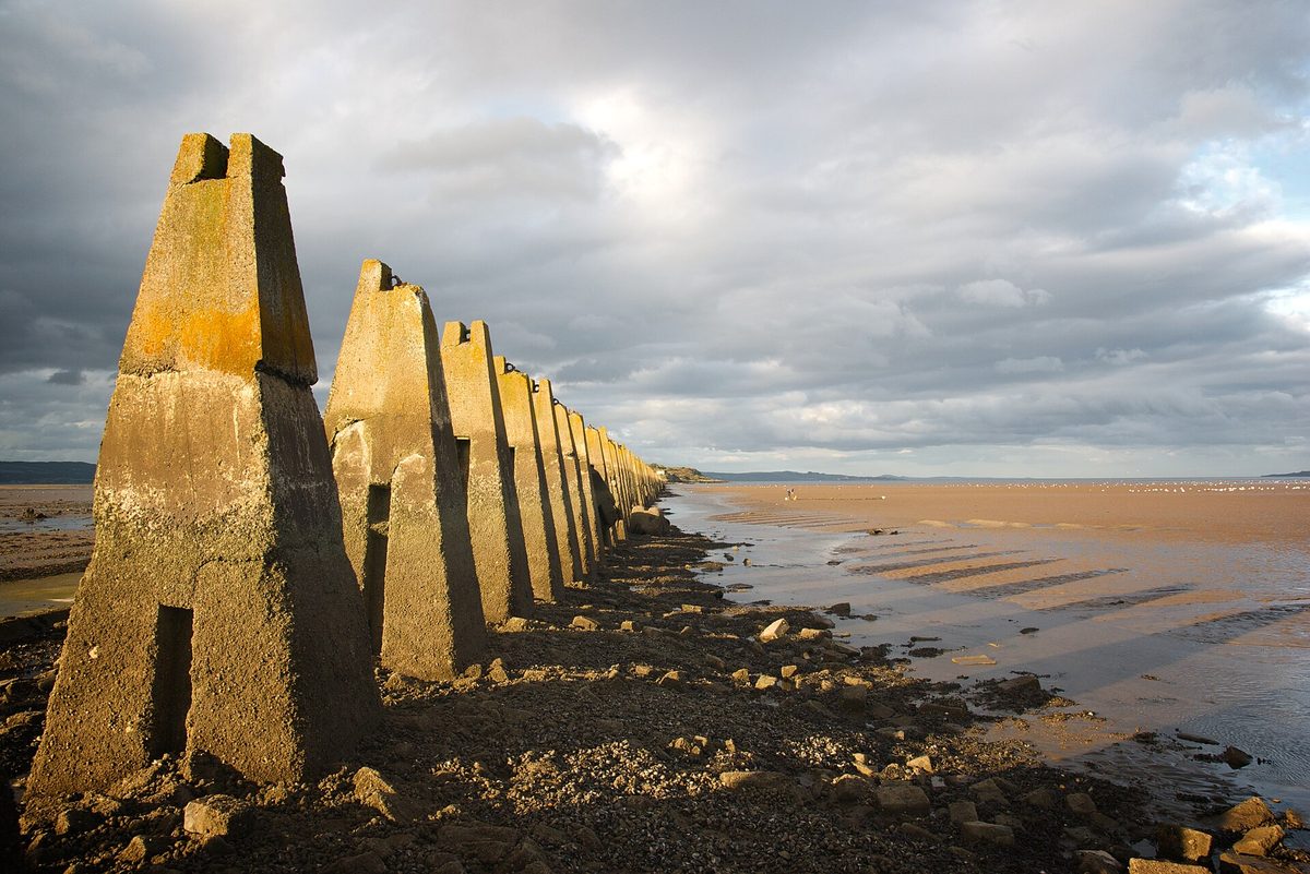 The tidal causeway and wartime pylons leading out to Cramond Island near Edinburgh at low tide