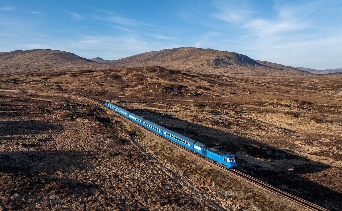 A train crossing Rannoch Moor on the West Highland Line, the wilderness the Hogwarts Express runs over in the Harry Potter films