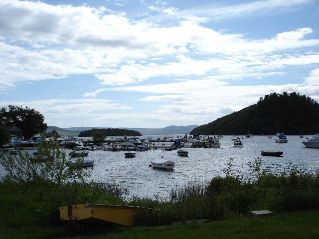 Small boats moored at Balmaha bay on the quieter east shore of Loch Lomond