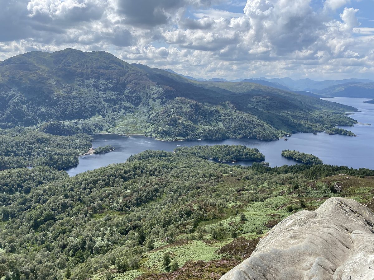 The view down to Loch Katrine and Ben Venue from the rocky summit of Ben A'an