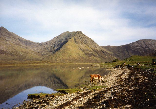 Mirror-flat water at Loch Slapin near Elgol on Skye, exactly the still conditions midges need