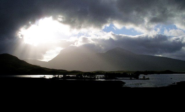 Lochan na h-Achlaise on Rannoch Moor with the Black Mount hills under broken light