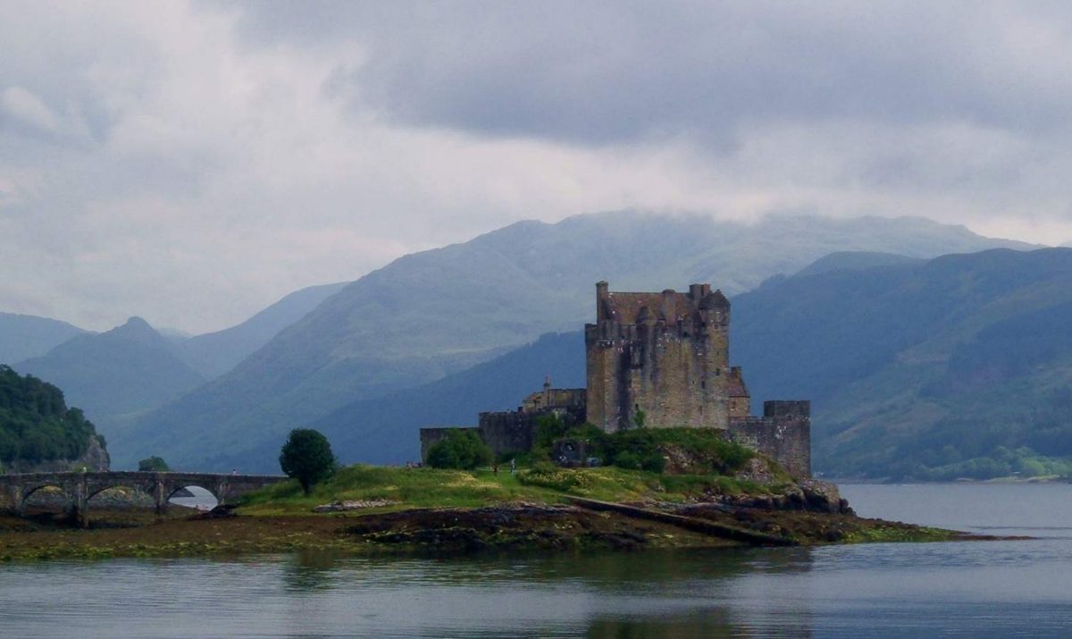 Eilean Donan Castle and its stone bridge at the meeting of three sea lochs