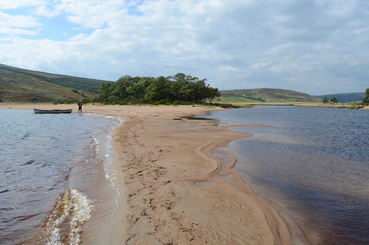 The sandy shore of Loch Brora in east Sutherland, near the NC500 campsite at Brora