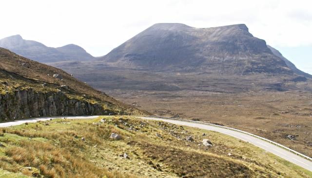 The A894 climbing past Quinag in Assynt, typical NC500 driving country