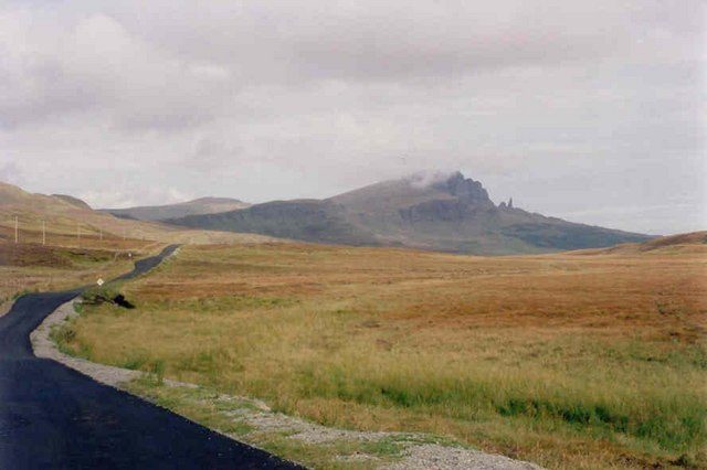 The A855 between Portree and Staffin with the Old Man of Storr under low cloud