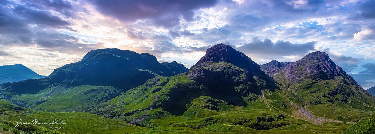 The Three Sisters ridge in Glen Coe under low cloud, a romantic Highland drive in Scotland