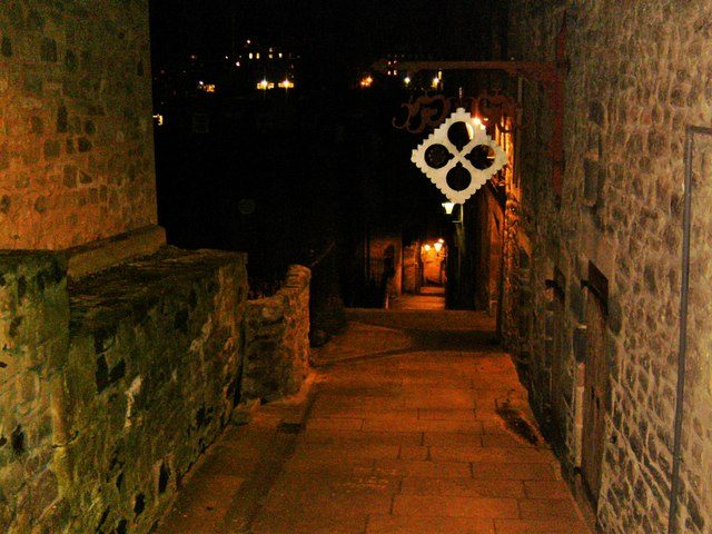 Advocate's Close after dark, a steep stepped close running north off the Royal Mile in Edinburgh