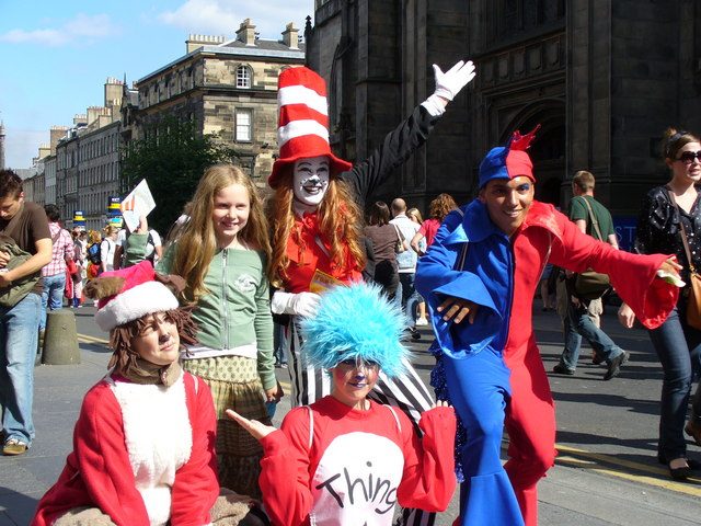 Costumed Fringe performers flyering on Edinburgh's Royal Mile during the August festival
