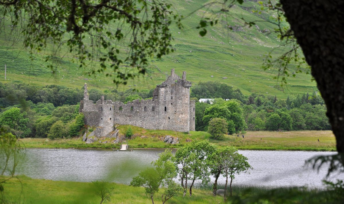Kilchurn Castle at the head of Loch Awe, seen from the Oban railway line
