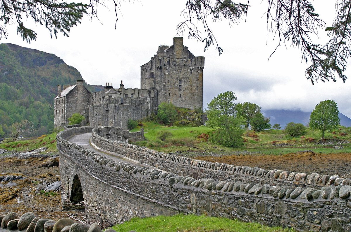 Eilean Donan Castle and its stone causeway bridge at the head of Loch Duich