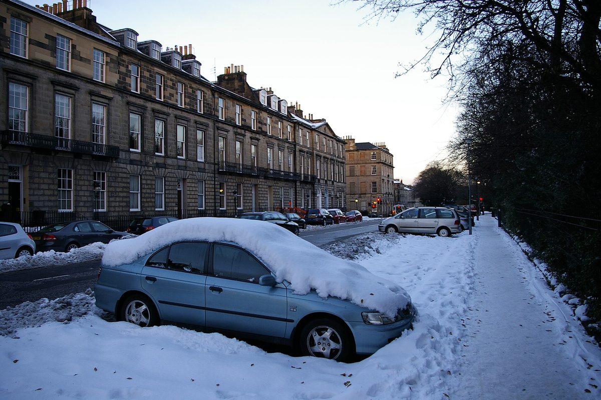 A snowed-in street in Edinburgh's New Town at dusk in winter