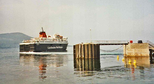 A Caledonian MacBrayne ferry arriving at a west coast pier, used by foot passengers travelling Scotland without a car