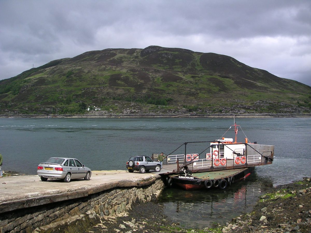 The MV Glenachulish, the world's last hand-operated turntable ferry, loading cars at the slipway