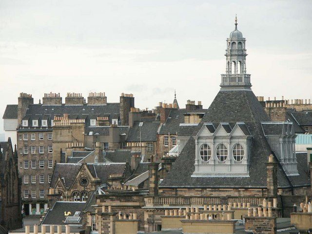 Edinburgh Old Town rooftops and spires seen from above, the most central area to stay in Edinburgh