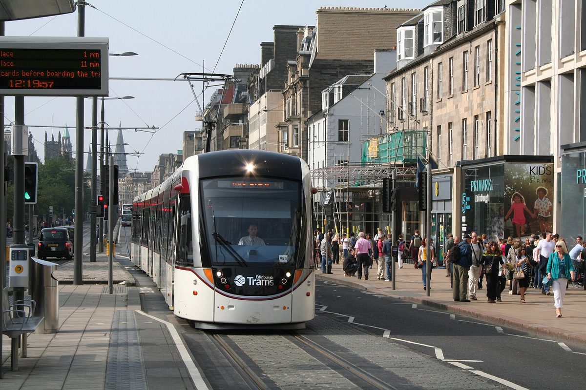 An Edinburgh tram on Princes Street, the airport line that serves one corridor of the city