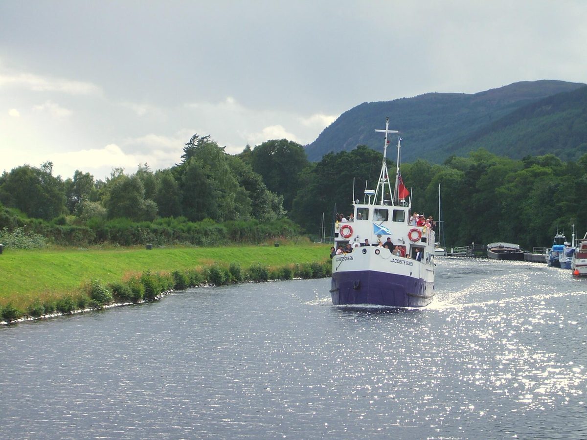 A Loch Ness cruise boat heading down the Caledonian Canal towards the loch