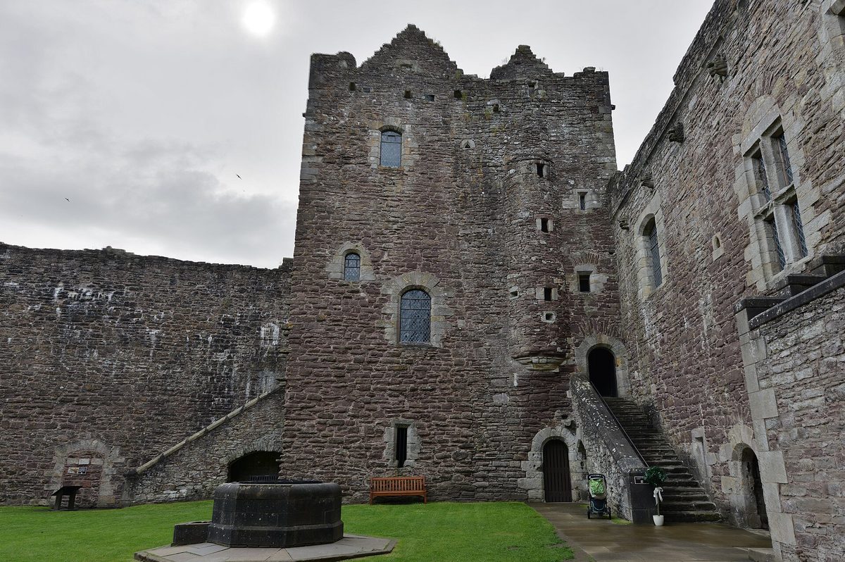 The courtyard at Doune Castle with the well and the outdoor stair up to the halls, used as Castle Leoch in Outlander