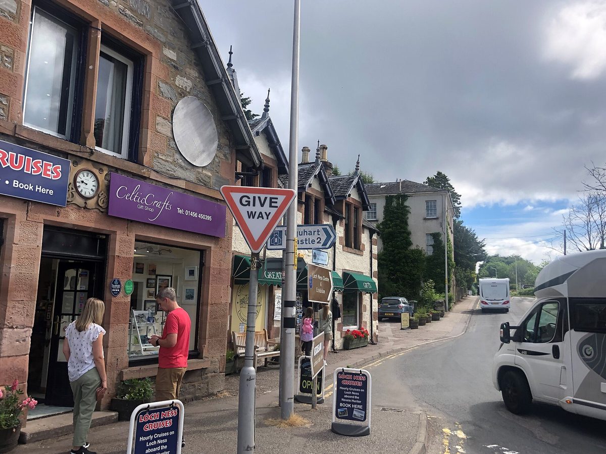 Gift shops and cruise booking boards in Drumnadrochit, the centre of Loch Ness monster tourism